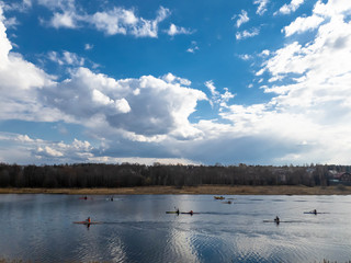 Naklejka premium A group of kayakers in training. Training kayakers on kayaks.