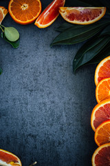 Dark Textured Background With Citrus and Greenery