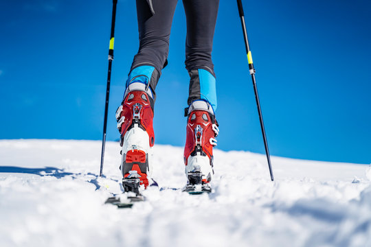 Legs of a man on a ski tour in winter in the mountains