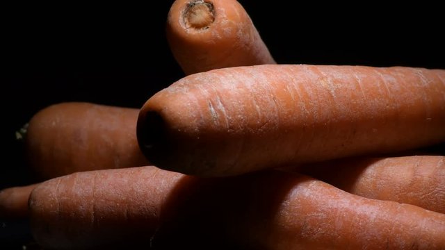 Natural carrots vegetables in a pile gyrating. Daucus carota