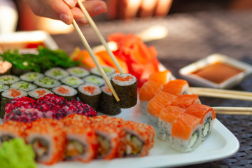 Nigiri roll with salmon. Sushi roll japanese food in restaurant.