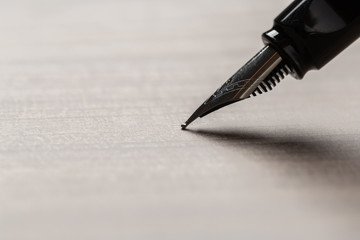 Black fountain pen on table