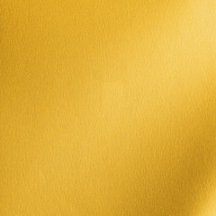 Naklejka premium Gold background metallic golden foil or shinny wrapping paper bright yellow wall paper leather texture for design decoration element