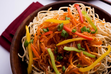 American chop suey/ chopsuey is a popular indochinese food. served in a bowl with chop sticks. selective focus