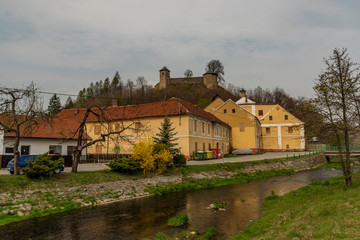 Obraz premium Brumov town and castle in east Moravia in spring cloudy day