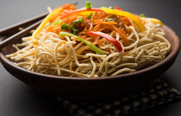 American chop suey/ chopsuey is a popular indochinese food. served in a bowl with chop sticks. selective focus