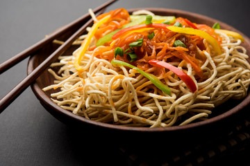 American chop suey/ chopsuey is a popular indochinese food. served in a bowl with chop sticks. selective focus