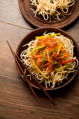 American chop suey/ chopsuey is a popular indochinese food. served in a bowl with chop sticks. selective focus