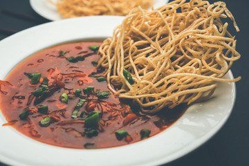 American chop suey/ chopsuey is a popular indochinese food. served in a bowl with chop sticks. selective focus