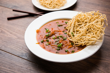 American chop suey/ chopsuey is a popular indochinese food. served in a bowl with chop sticks. selective focus