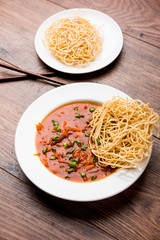 American chop suey/ chopsuey is a popular indochinese food. served in a bowl with chop sticks. selective focus