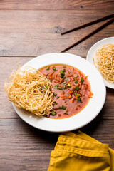 American chop suey/ chopsuey is a popular indochinese food. served in a bowl with chop sticks. selective focus