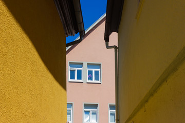 orange historical house facades on blue sky