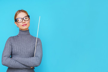 Photo of woman teacher with pointer on empty blue background.