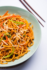 American chop suey/ chopsuey is a popular indochinese food. served in a bowl with chop sticks. selective focus