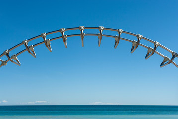 Sea and blue sky with metal bars