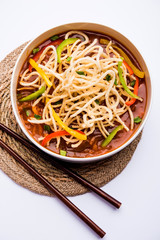 American chop suey/ chopsuey is a popular indochinese food. served in a bowl with chop sticks. selective focus