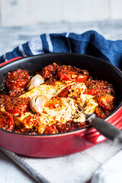Grilled feta cheese with tomatoes and garlic