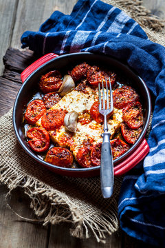 Grilled feta cheese with tomatoes and garlic