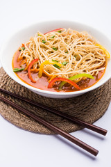 American chop suey/ chopsuey is a popular indochinese food. served in a bowl with chop sticks. selective focus