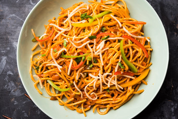 American chop suey/ chopsuey is a popular indochinese food. served in a bowl with chop sticks. selective focus