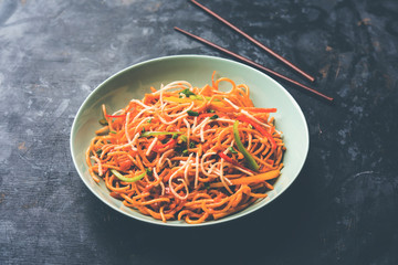 American chop suey/ chopsuey is a popular indochinese food. served in a bowl with chop sticks. selective focus