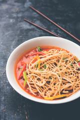 American chop suey/ chopsuey is a popular indochinese food. served in a bowl with chop sticks. selective focus