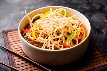 American chop suey/ chopsuey is a popular indochinese food. served in a bowl with chop sticks. selective focus