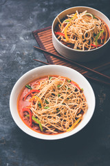 American chop suey/ chopsuey is a popular indochinese food. served in a bowl with chop sticks. selective focus