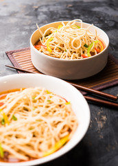 American chop suey/ chopsuey is a popular indochinese food. served in a bowl with chop sticks. selective focus