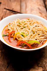 American chop suey/ chopsuey is a popular indochinese food. served in a bowl with chop sticks. selective focus