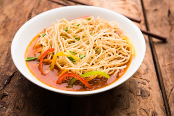 American chop suey/ chopsuey is a popular indochinese food. served in a bowl with chop sticks. selective focus