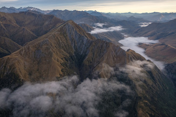 Flying over mountain range on the way to Milford Sound, South Island, New Zealand