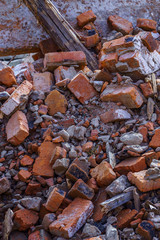 bunch of broken red bricks and other debris