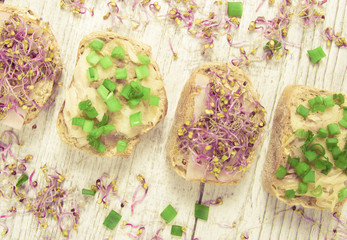 Sandwiches with ham, smoked mackerel and kale sprouts as an ingredient of a healthy diet.