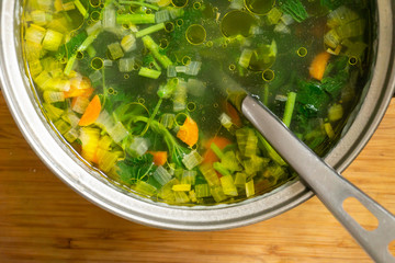 Vegetable soup with fresh nettles. Vegetarian food