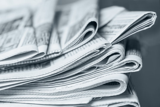 News concept, folded newspaper closeup.