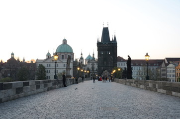 Fototapeta na wymiar Old town side of the Charles Bridge in Prague at sunrise