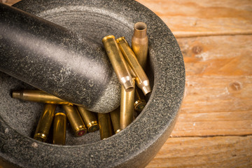 Mortar and pestle with bullets
