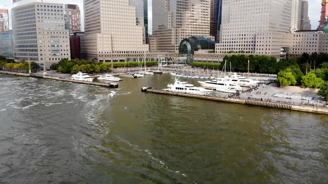 Aerial view of boats docked at the North Cove Marina (Hudson River) at Battery Park in Manhattan with Brookfield Place Complex and offices buildings on the background. New York, USA.