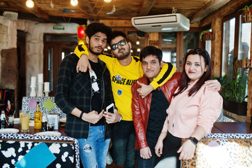 Group of asian people friends posed indoor cafe together.