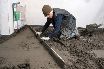 builders poured concrete at the construction site