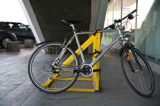 Photo of parked bicycle under the stairs for graphic and web design, for website or mobile app.