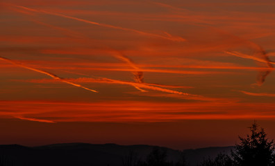 Red and orange sunset sky near Ceske Budejovice city in spring evening