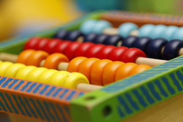 Naklejka premium Children's wooden abacus. Learn to add and subtract with an abacus