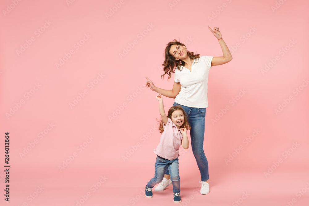 Wall mural woman in light clothes have fun with cute child baby girl. mother, little kid daughter isolated on p