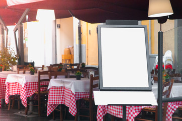 Italian restaurant with blank menu board on a stand