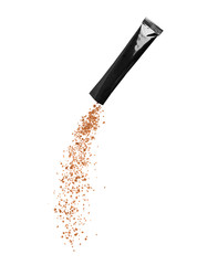 Freeze dried instant coffee pours from the packaging, isolated on a white background.