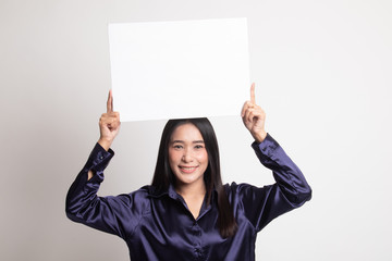 Young Asian woman with white blank sign.