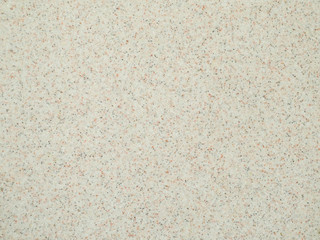 Texture of gray brown stone with small inclusions.
